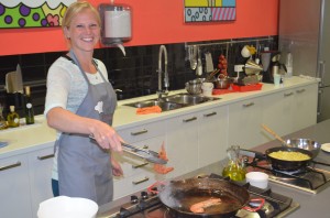 Barcelona cooking class. Karen learning to make seafood paella!